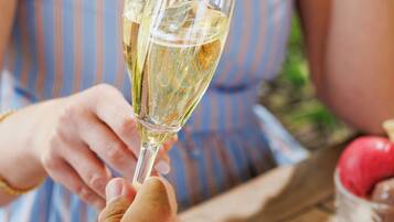 A person holding a champagne glass.