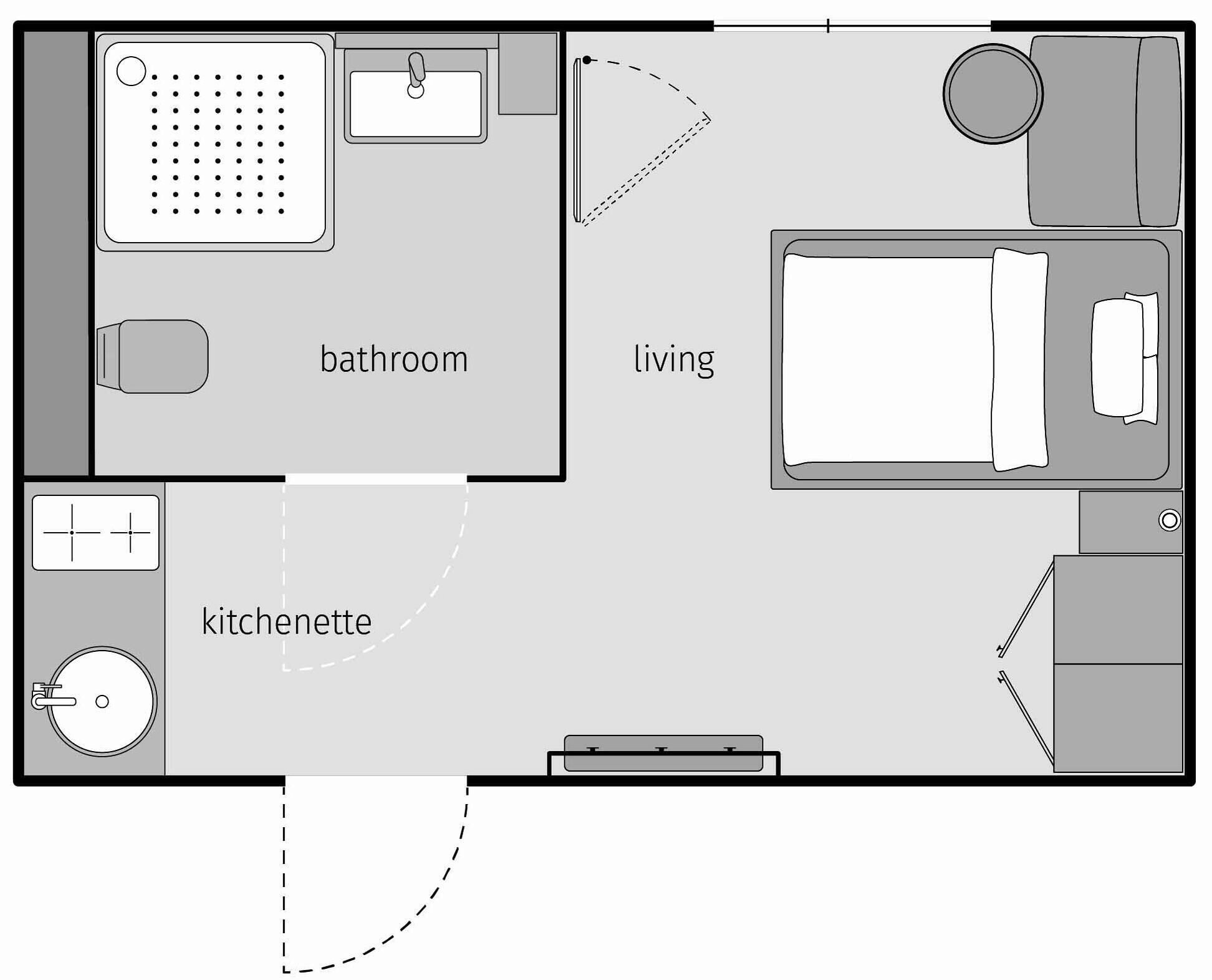 Plano de un cuarto de hotel con baño, kitchenette y sala de estar.