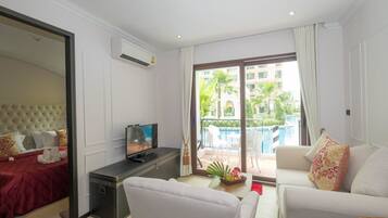 Deluxe Room with Pool Access | Blackout drapes, free WiFi, bed sheets