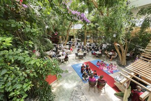 Enjoy meals and drinks amidst lush greenery and rustic charm.