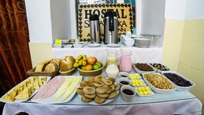 A breakfast buffet with various food items and beverages. - Samay Inka Inn (Cusco)
