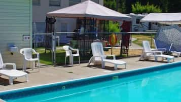 Seasonal outdoor pool, pool loungers