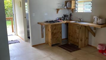 Bungalow 3, 1 Bedroom, Beachfront | Private kitchen | Full-size fridge, electric kettle, toaster, cookware/dishes/utensils