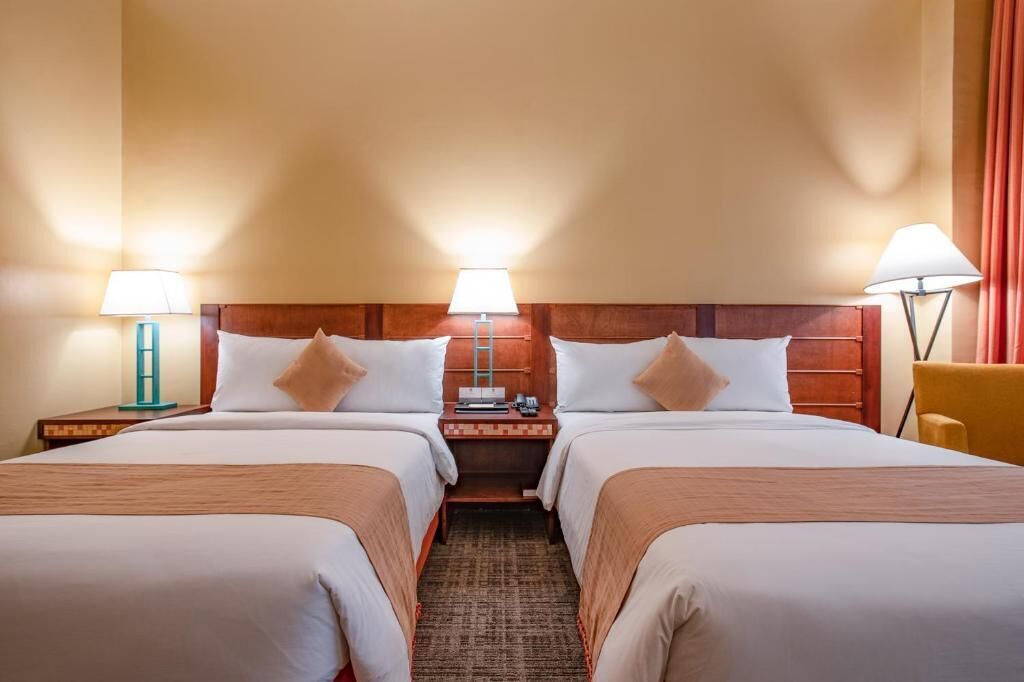 Minibar, desk, blackout curtains, iron/ironing board