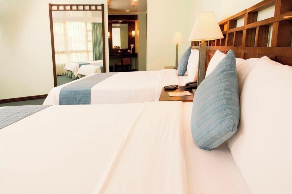 Minibar, desk, blackout curtains, iron/ironing board