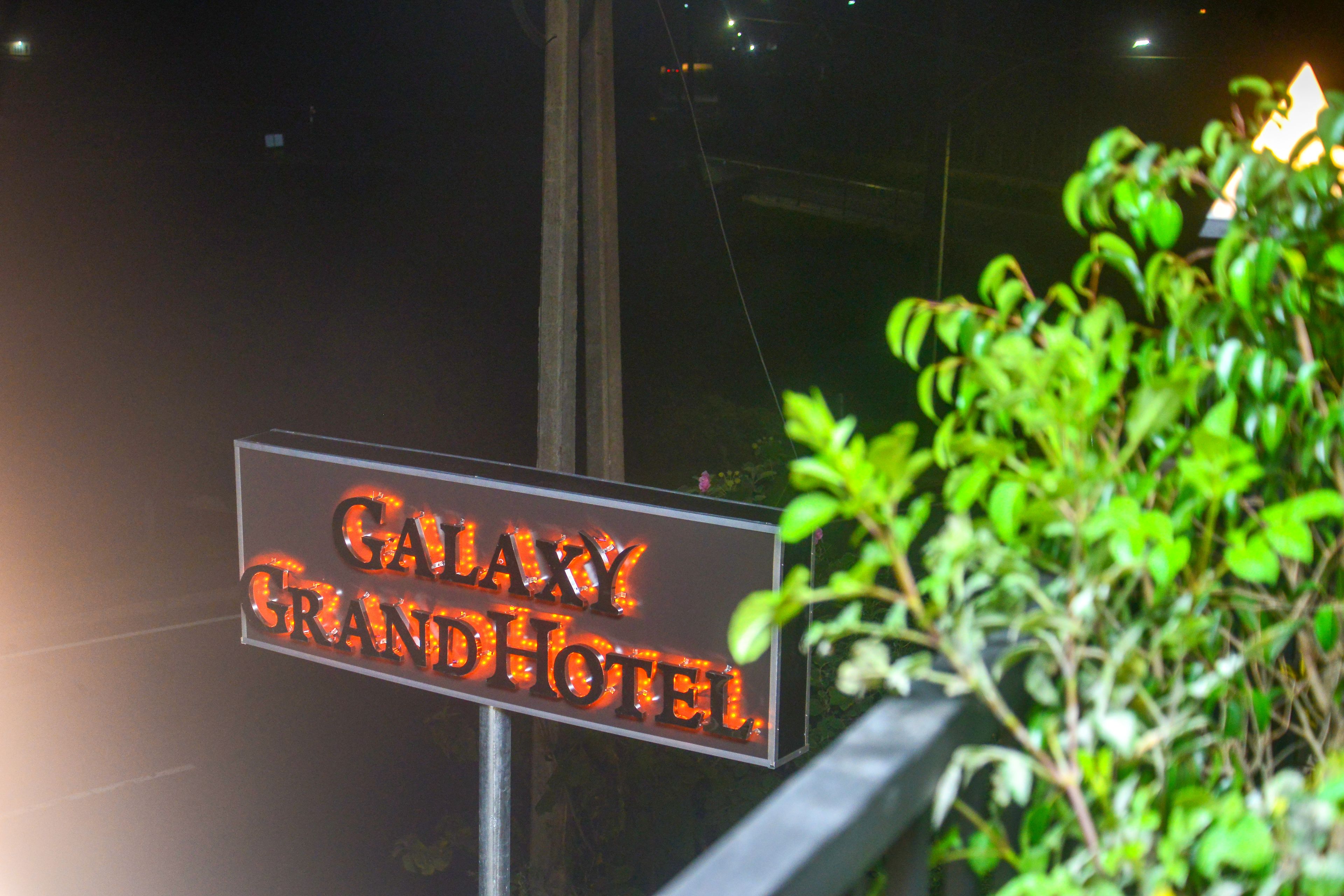 A sign for the Galaxy Grand Hotel.