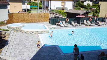 Seasonal outdoor pool, open 8:00 AM to 8:00 PM, pool umbrellas