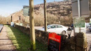 A parking sign for the Ladybower Inn offering free parking for customers. - Ladybower Inn (Hope Valley)