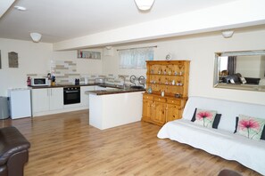 Family Studio, 1 Bedroom, Garden View, Ground Floor | Living area | Flat-screen TV, Netflix
