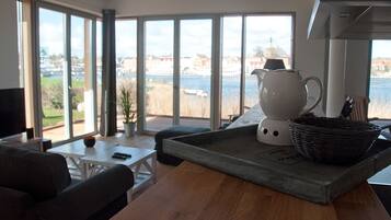 Deluxe Apartment, Terrace, River View | Living area | Flat-screen TV, fireplace, DVD player