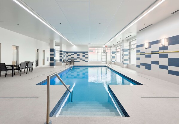Indoor pool, open 7:00 AM to 10:00 PM, pool loungers