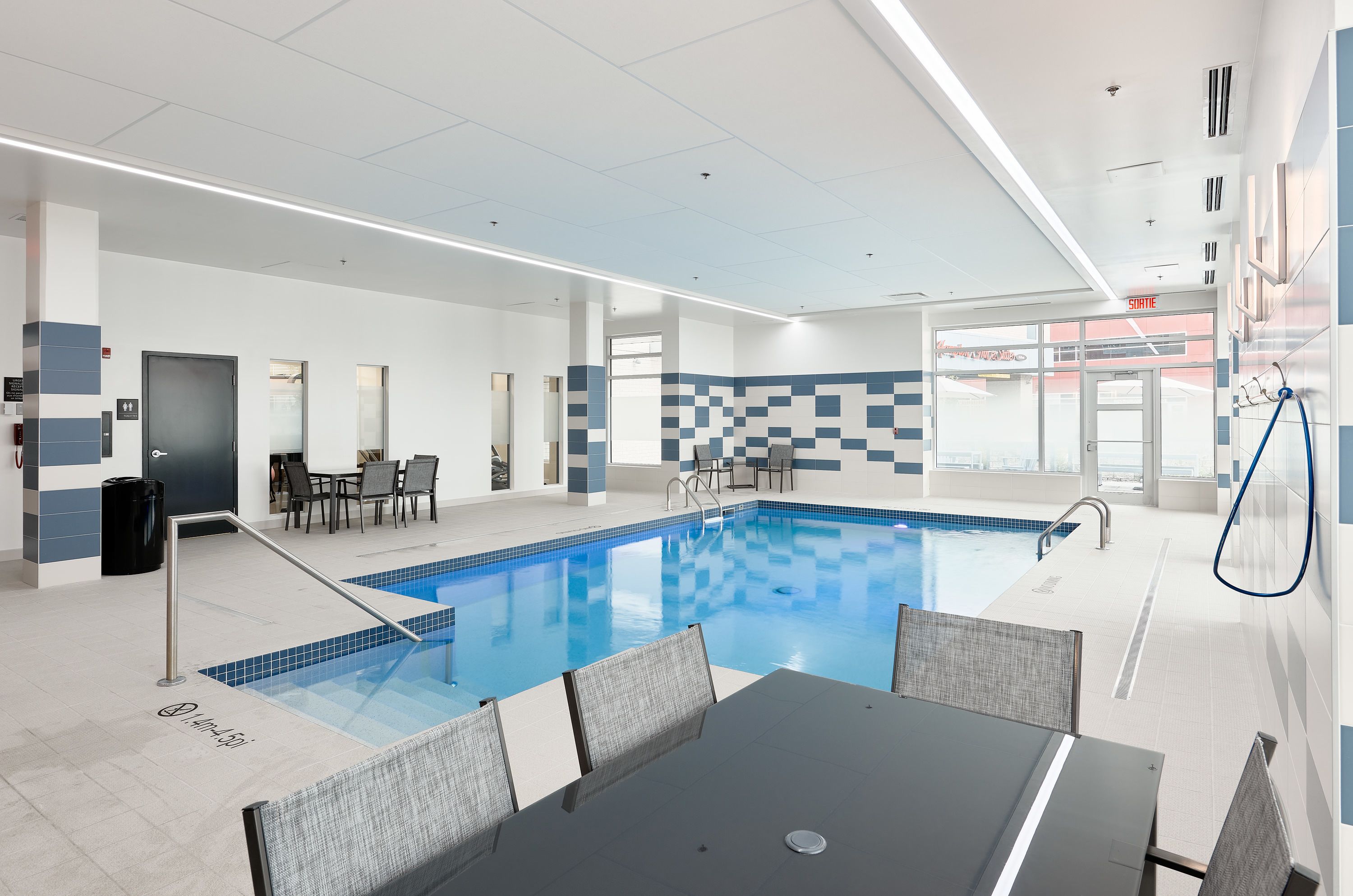 indoor pool, open 7:00 am to 10:00 pm, pool loungers