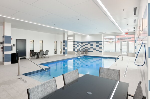 Indoor pool, open 7:00 AM to 10:00 PM, pool loungers