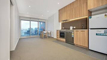 One Bedroom Apartment | Private kitchen | Full-sized fridge, microwave, oven, stovetop