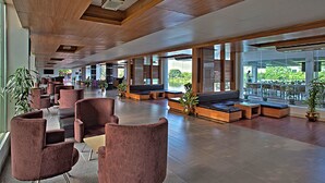 A spacious lobby with modern seating arrangements and large windows offering views of the outdoors. - BRAC-CDM Savar (Savar)