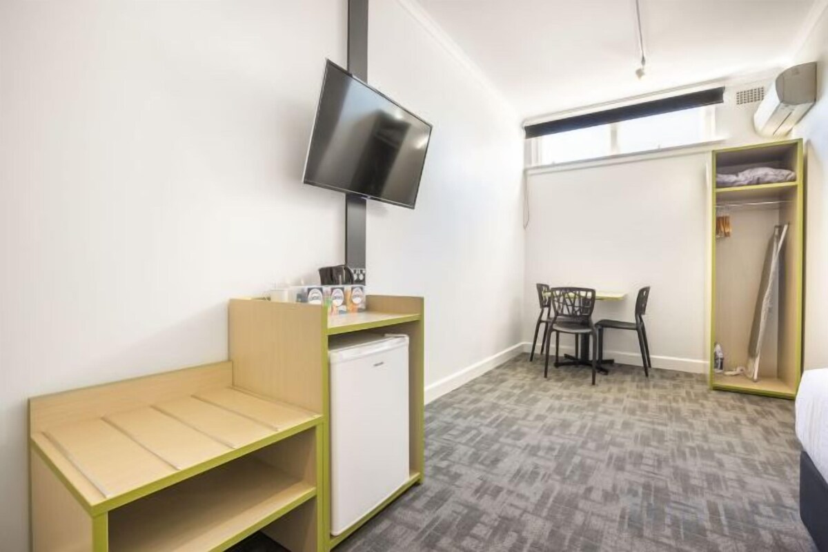 Desk, laptop workspace, iron/ironing board, cribs (free)