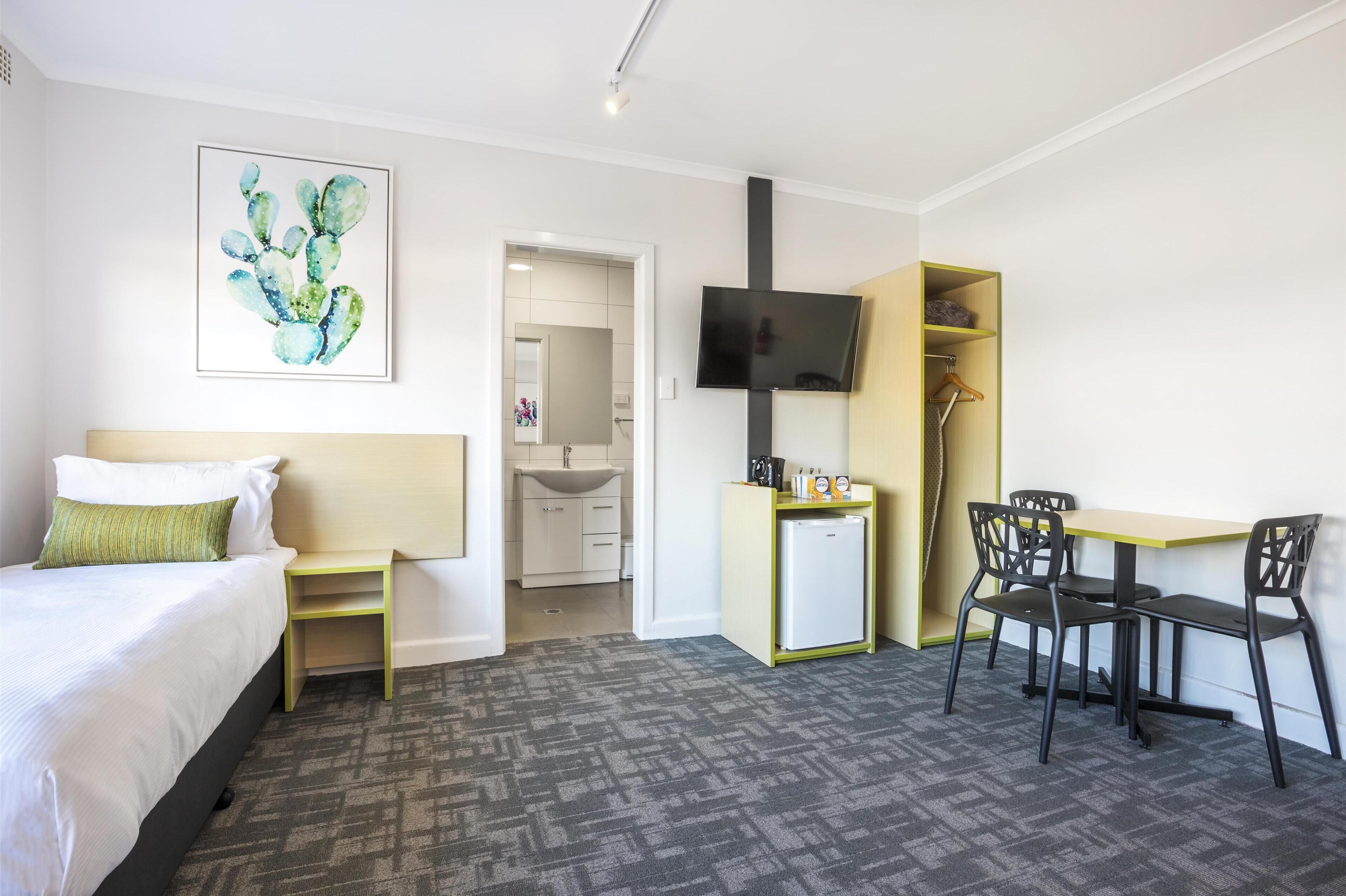 studio family | desk, laptop workspace, iron/ironing board, free cots/infant beds