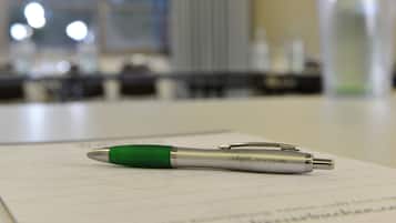 A pen on a piece of paper in an indoor setting.