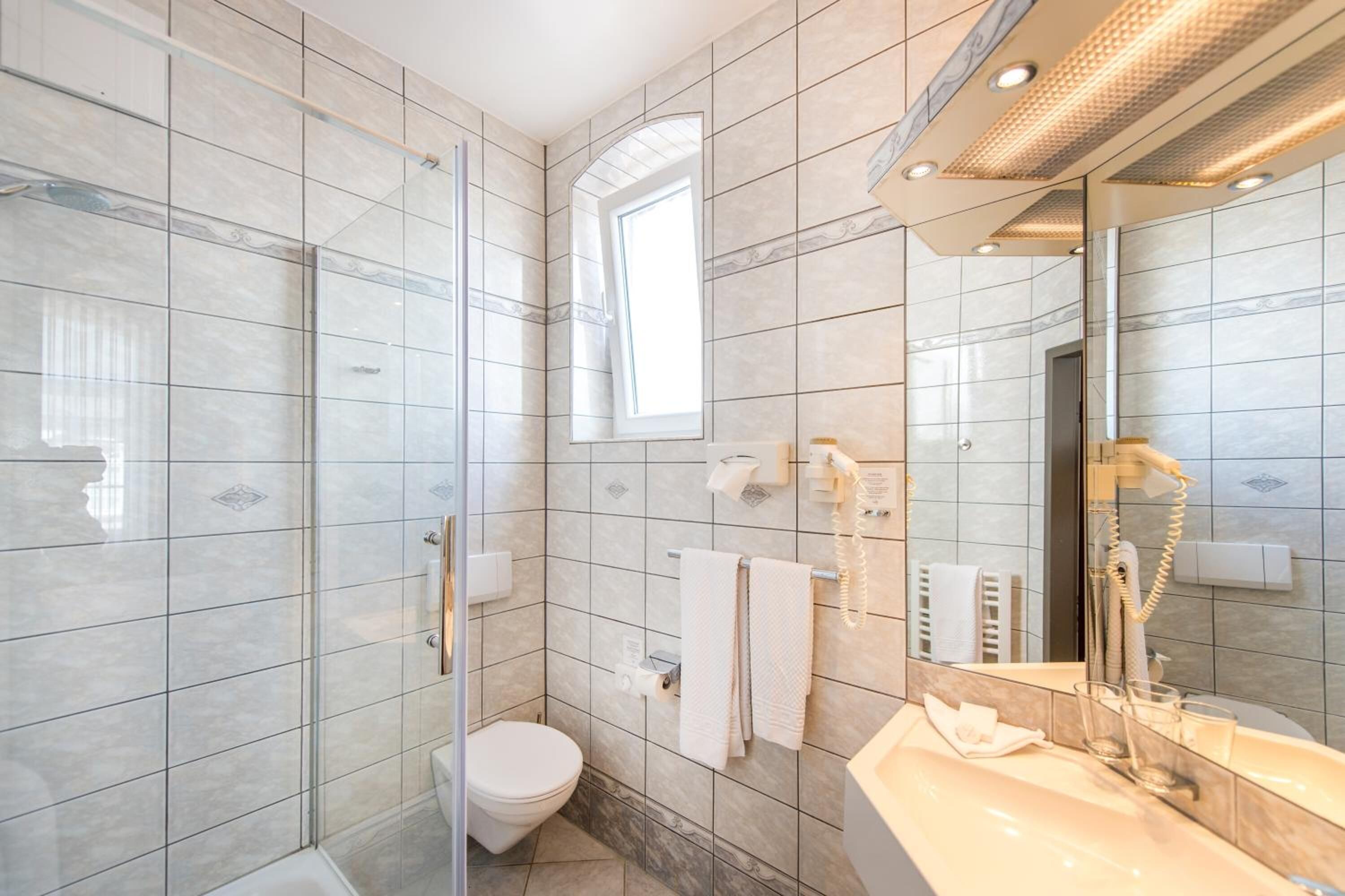 shower, free toiletries, hair dryer, towels