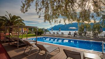 Seasonal outdoor pool, pool umbrellas, sun loungers
