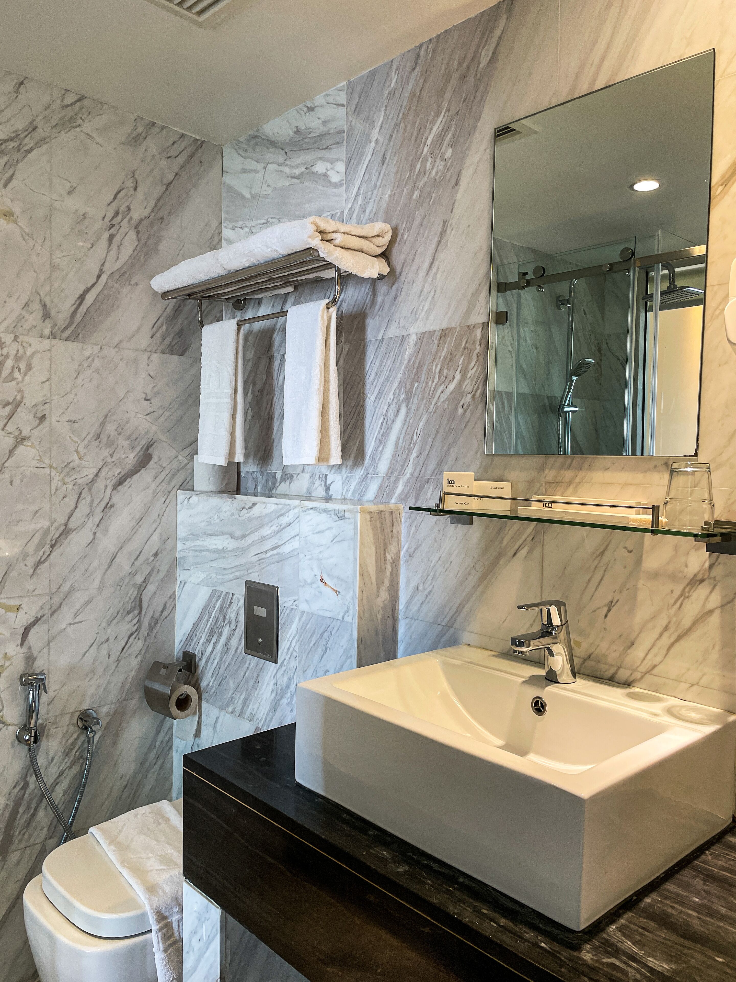 deluxe queen room | bathroom | shower, rainfall showerhead, free toiletries, hair dryer