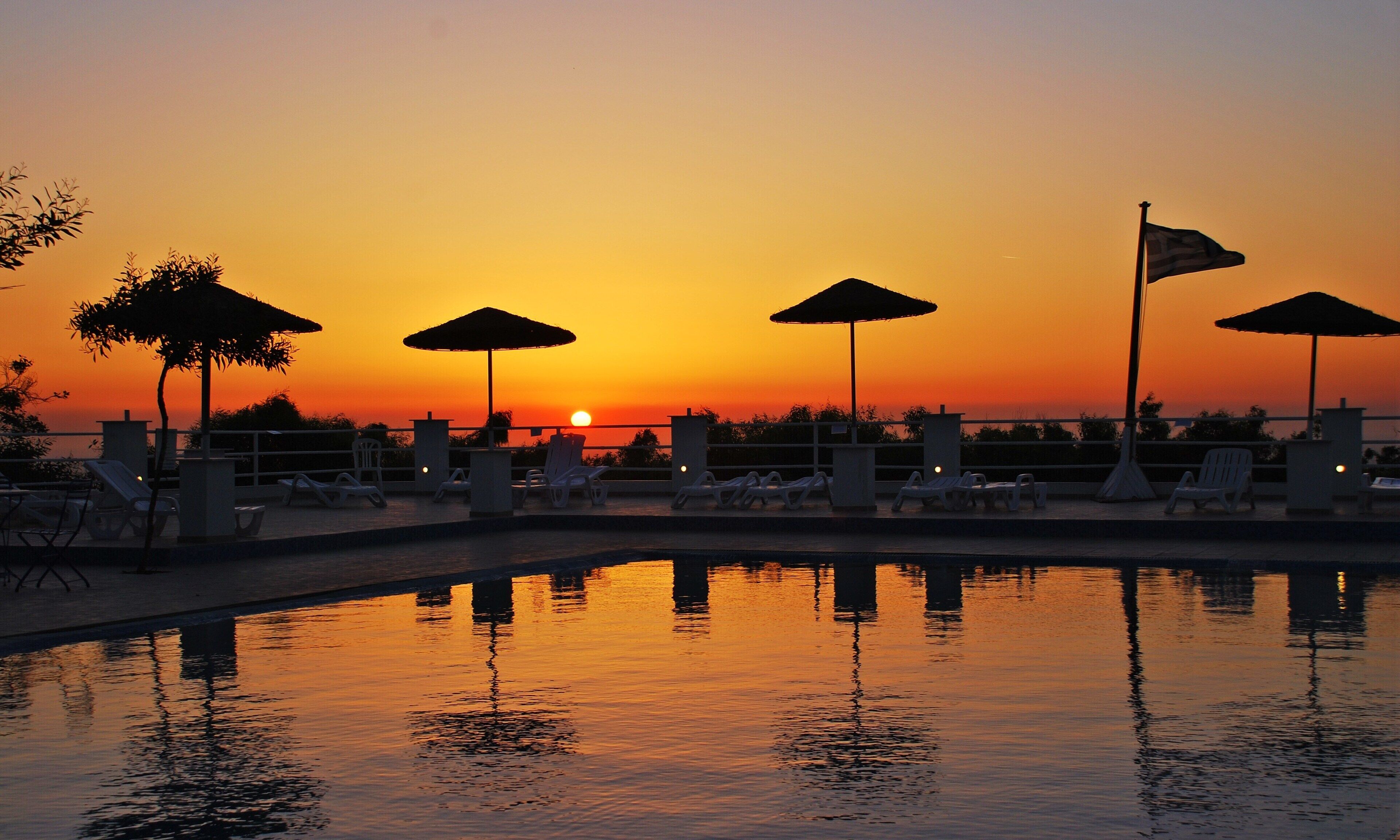Outdoor pool, open 9:00 AM to 8:00 PM, pool umbrellas, sun loungers