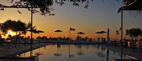 Outdoor pool, open 9:00 AM to 8:00 PM, pool umbrellas, sun loungers