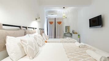 Superior Triple Room, Garden View | Literie de qualité supérieure, minibar, chambres insonorisées