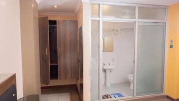Shower, free toiletries, slippers, towels