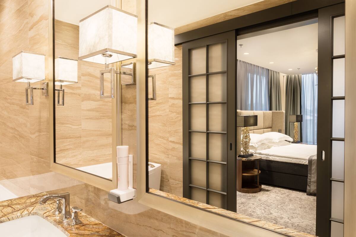 suite | bathroom | designer toiletries, hair dryer, bathrobes, slippers