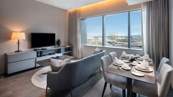 Apartamento ejecutivo, 1 habitación | Zona de estar | Una televisión LCD, una tableta