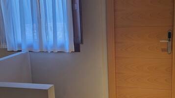 Desk, laptop workspace, blackout curtains, free WiFi