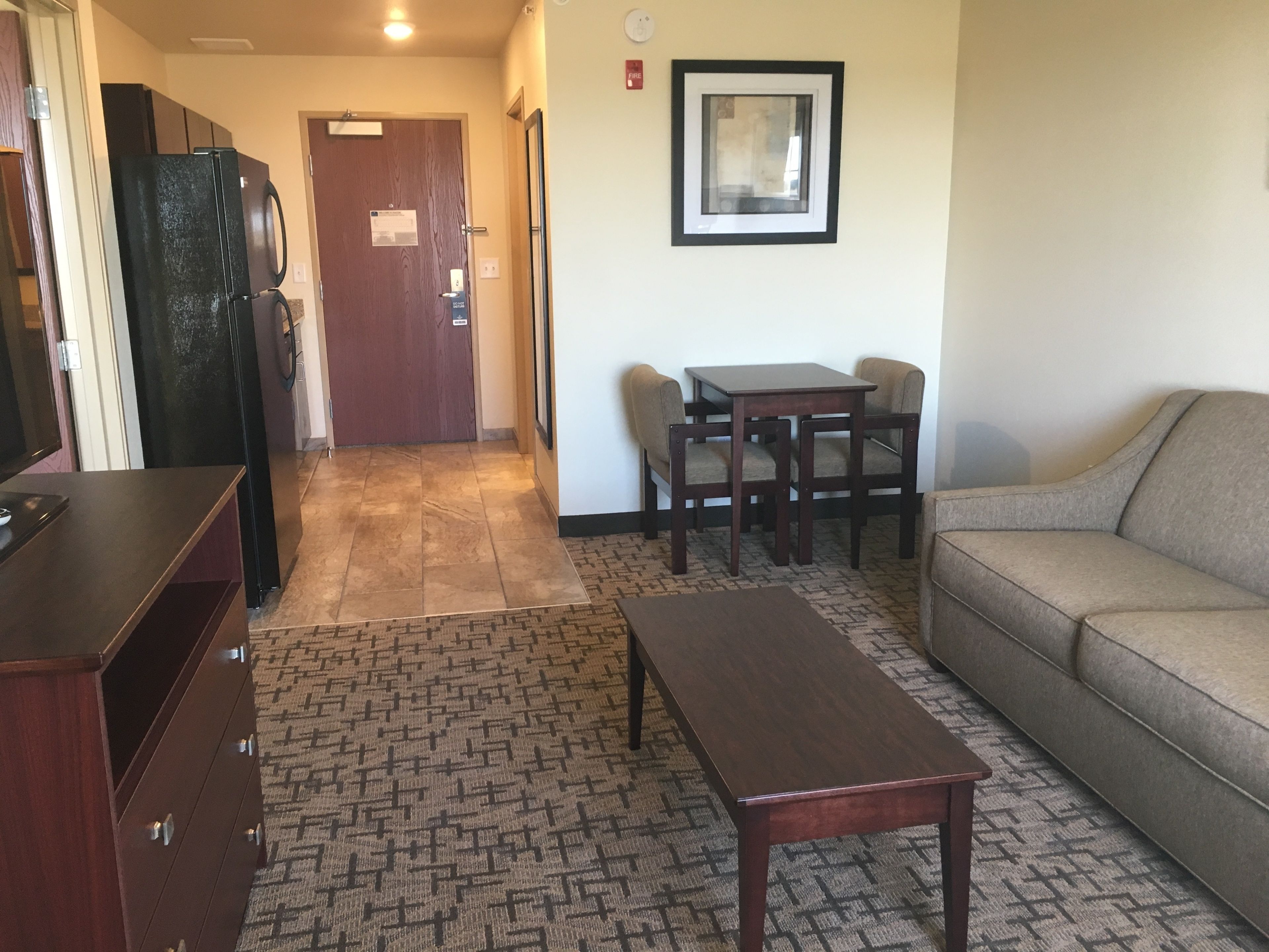suite, 1 king bed, non smoking (extended stay - no pets) | living area | flat-screen tv
