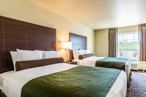 Room, 2 Queen Beds, Non Smoking | In-room safe, desk, laptop workspace, iron/ironing board