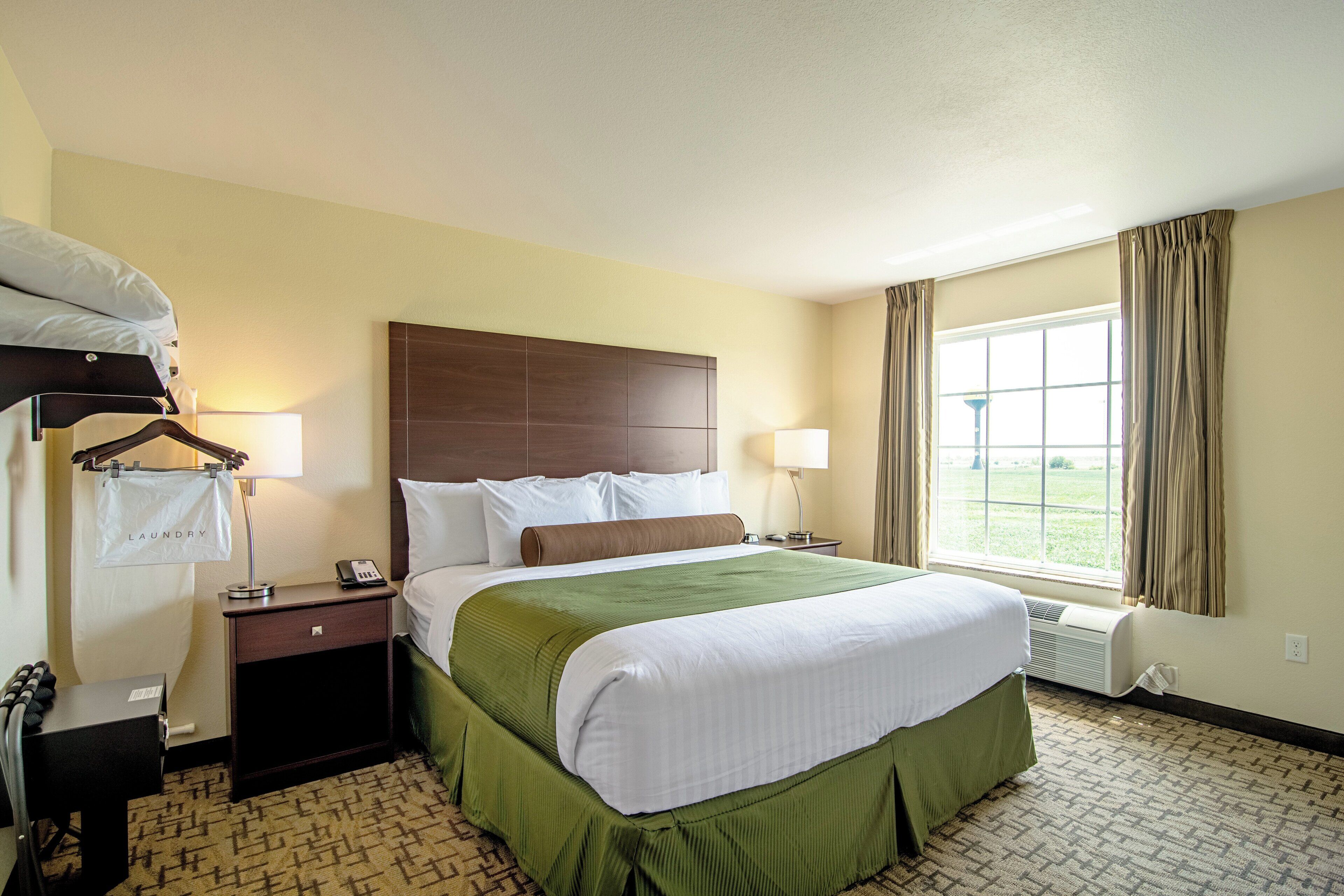 suite, 1 king bed, non smoking (extended stay - no pets) | in-room safe, desk, laptop workspace, iron/ironing board