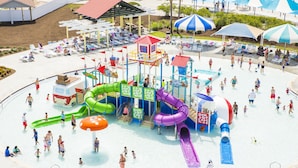 A water park with multiple slides and play structures. - Jekyll Ocean Club (Jekyll Island)