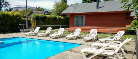 Outdoor pool, open 10:00 AM to 10:00 PM, pool umbrellas, sun loungers