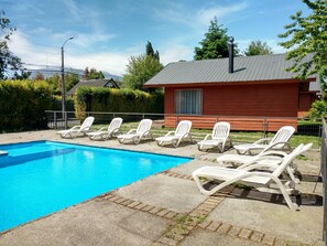Outdoor pool, open 10:00 AM to 10:00 PM, pool umbrellas, pool loungers