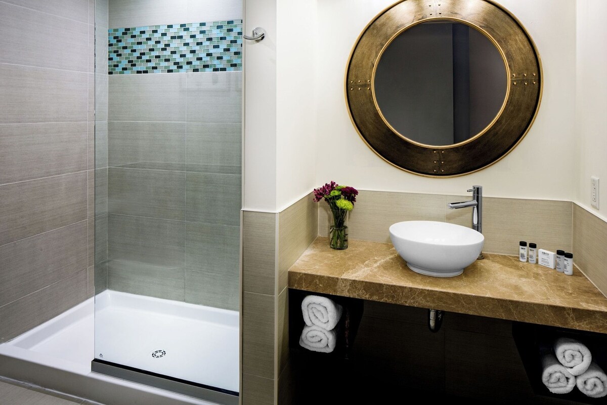 Bathroom | Designer toiletries, hair dryer, towels, soap