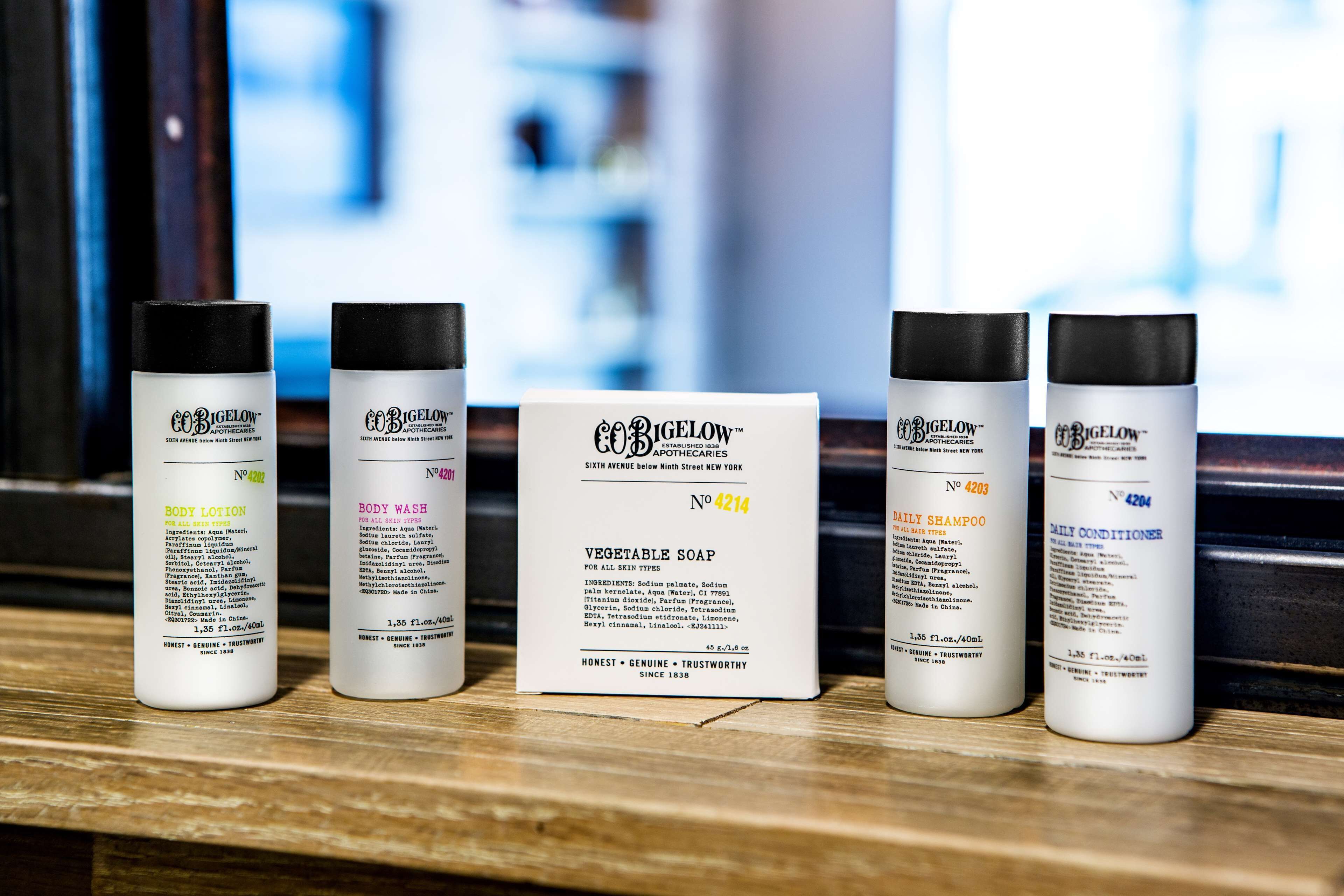 designer toiletries, hair dryer, towels, soap