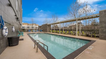 Outdoor pool, open 8 AM to 11 PM, pool loungers