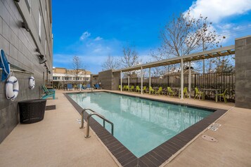 Outdoor pool, open 8 AM to 11 PM, pool loungers