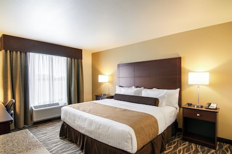 In-room safe, desk, laptop workspace, iron/ironing board. Cobblestone Inn & Suites at UW Stout Downtown Menomonie