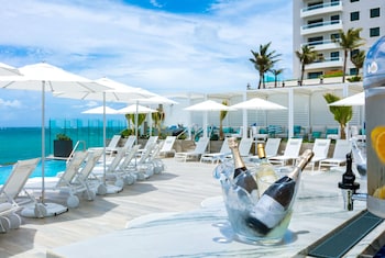 On the beach, beach towels at Condado Ocean Club - Adults Only