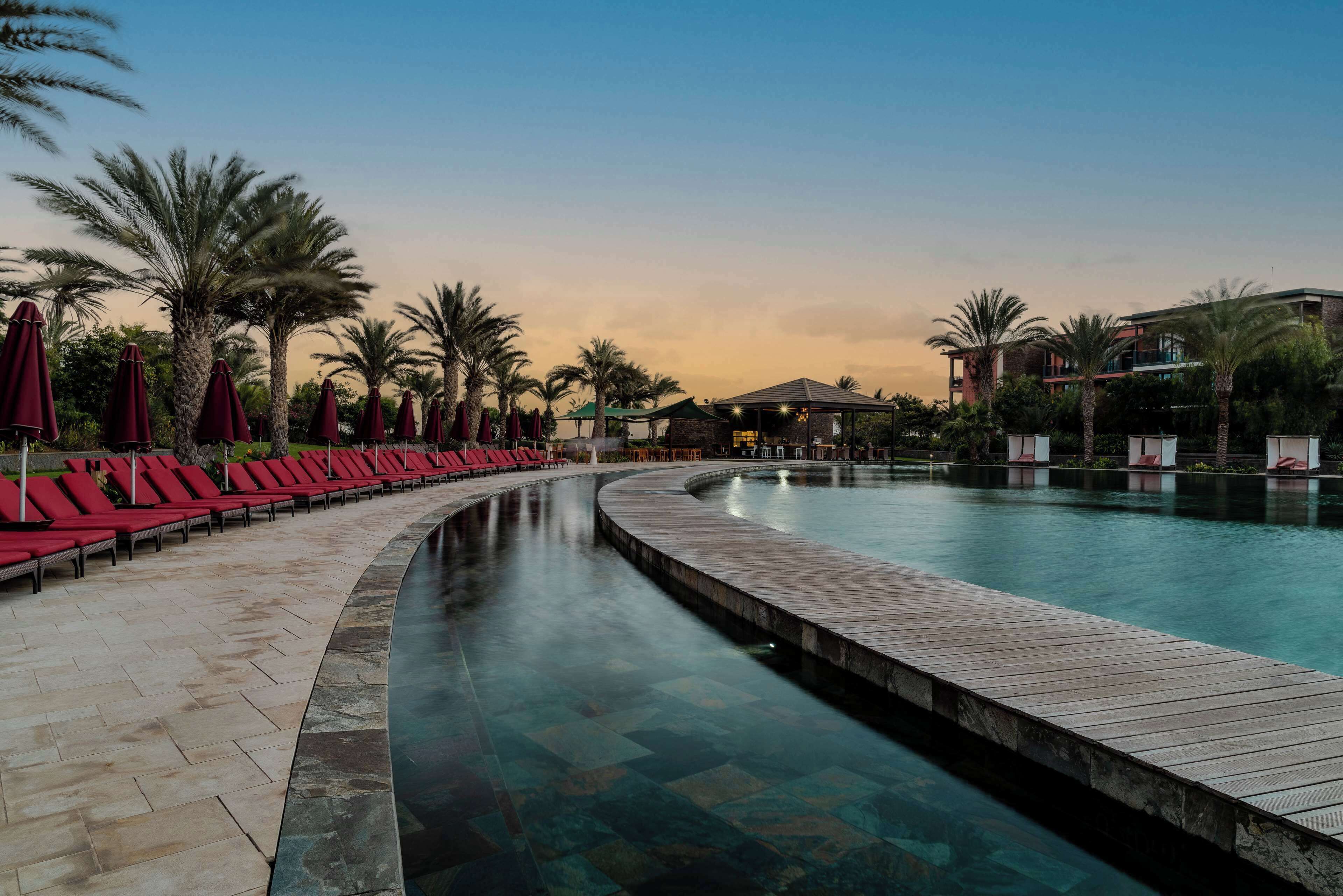 2 outdoor pools, open 8:00 am to 7:00 pm, pool umbrellas, pool loungers