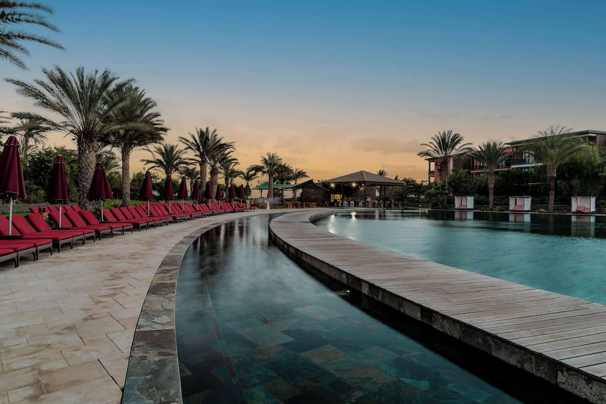 2 outdoor pools, open 8:00 am to 7:00 pm, pool umbrellas, pool loungers