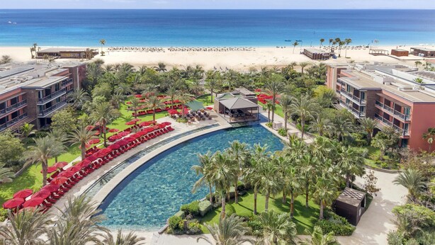 A resort with a pool, beach, and ocean view. - Hilton Cabo Verde Sal Resort (Sal)