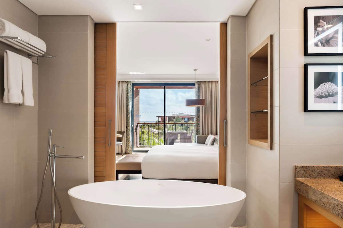 deluxe room, 1 king bed | bathroom | free toiletries, hair dryer, towels, soap