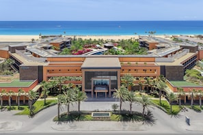 A modern hotel with a central entrance, multiple wings, and a pool area. - Hilton Cabo Verde Sal Resort (Sal)