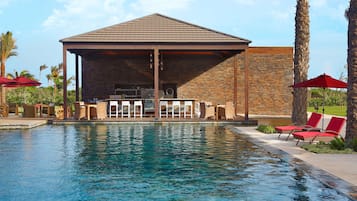 2 outdoor pools, open 9:00 AM to 6:00 PM, pool umbrellas, pool loungers